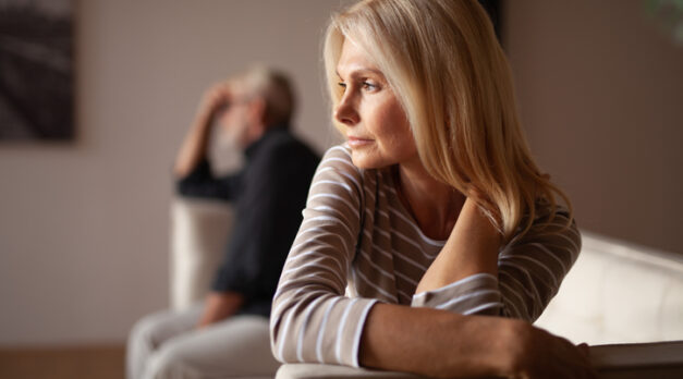 The older couple has a conflict. Upset mature woman, quarrel with her husband. Relationship crisis.