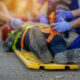 Selective focus shoe . Team paramedic firs aid accident on road. Ambulance emergency service. First aid procedure.